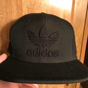 Adidas snap back all black hat.